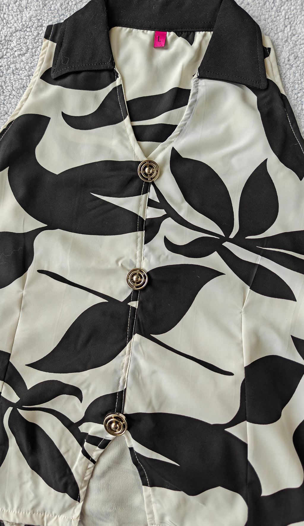 close up of black and white patterned sleeveless top co ord set women