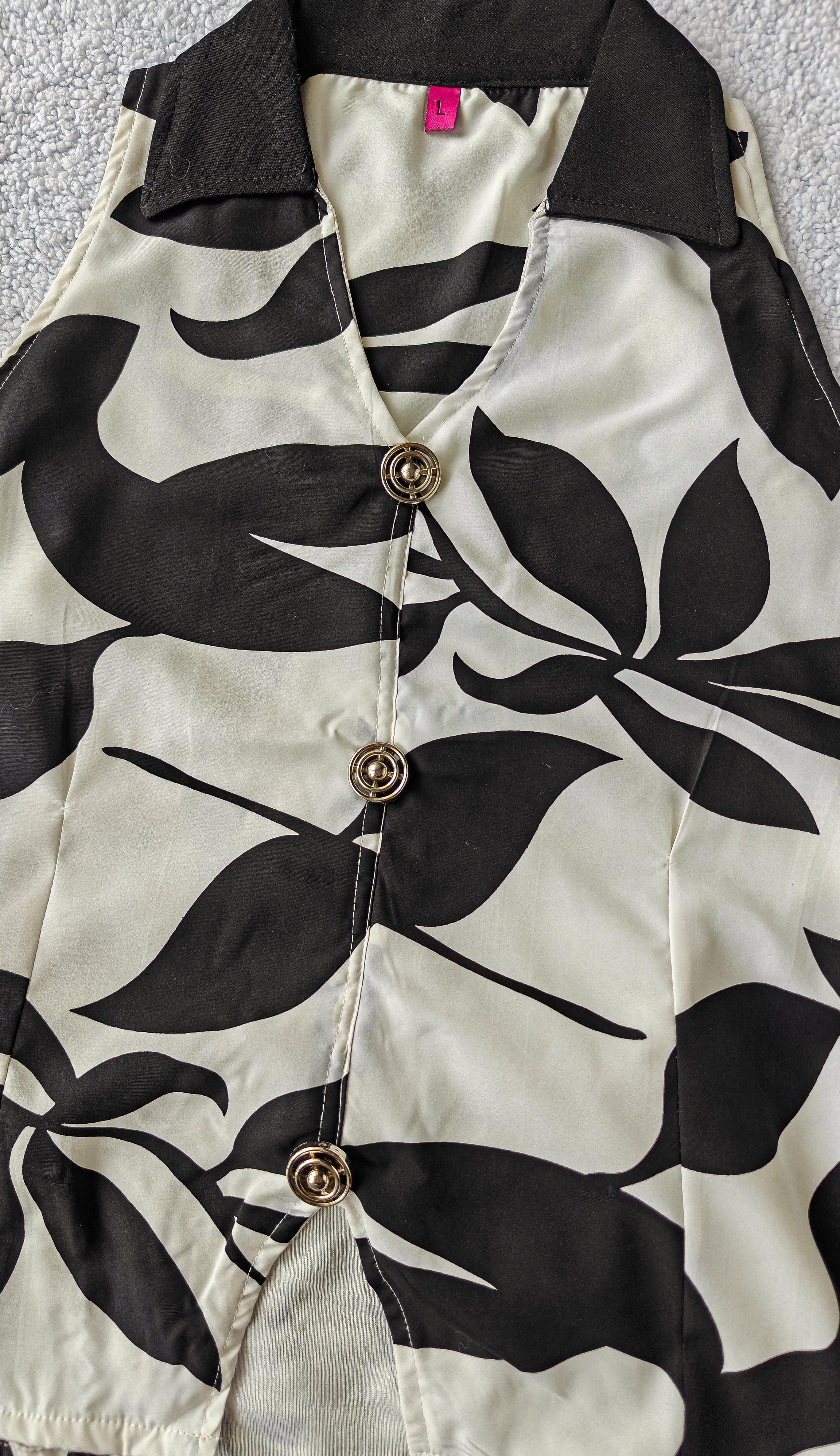 close up of black and white patterned sleeveless top co ord set women