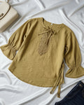 green belted women's top