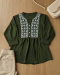 Green women's top with white embroidery 