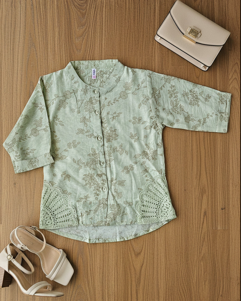 Light green floral blouse with lace details 