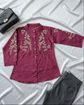 Maroon women's shirt with gold embroidery