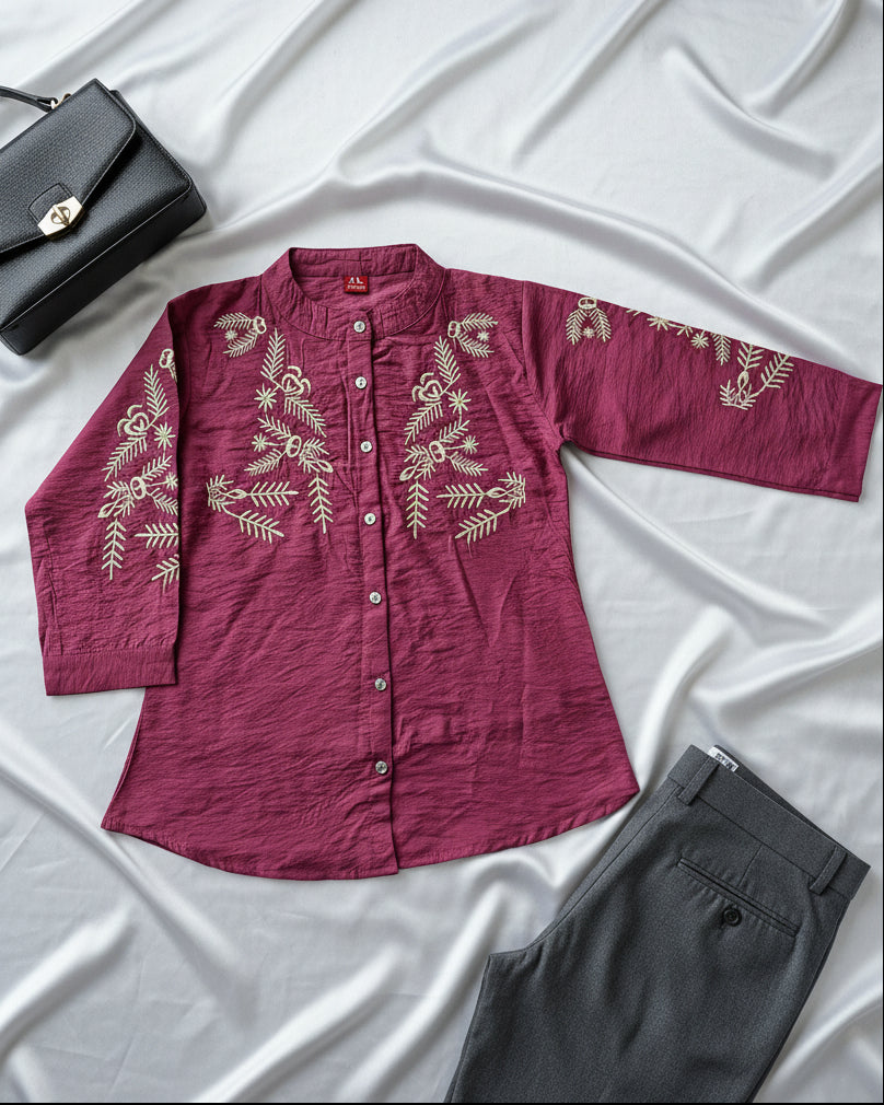 Maroon women's shirt with gold embroidery