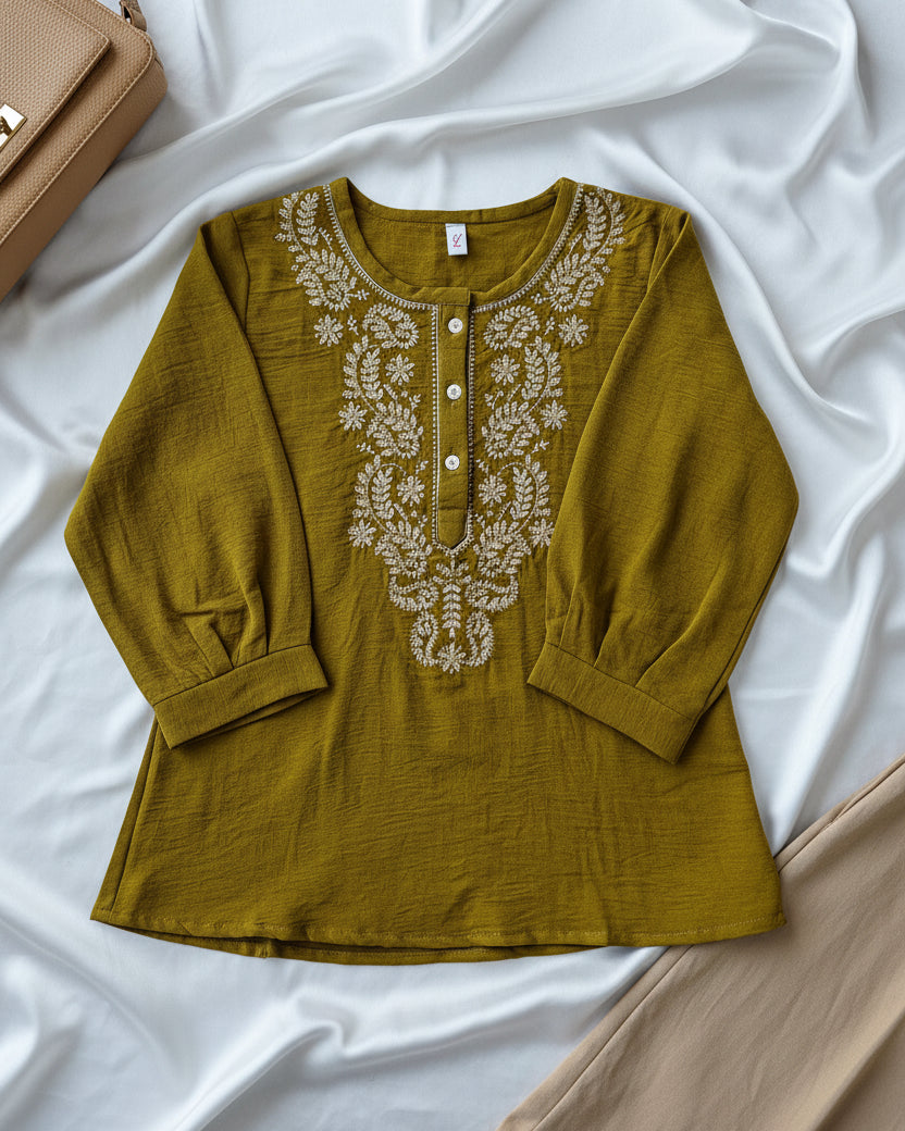 Olive green top with intricate white embroidery 