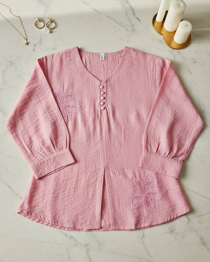 Pink blouse with floral embroidery
