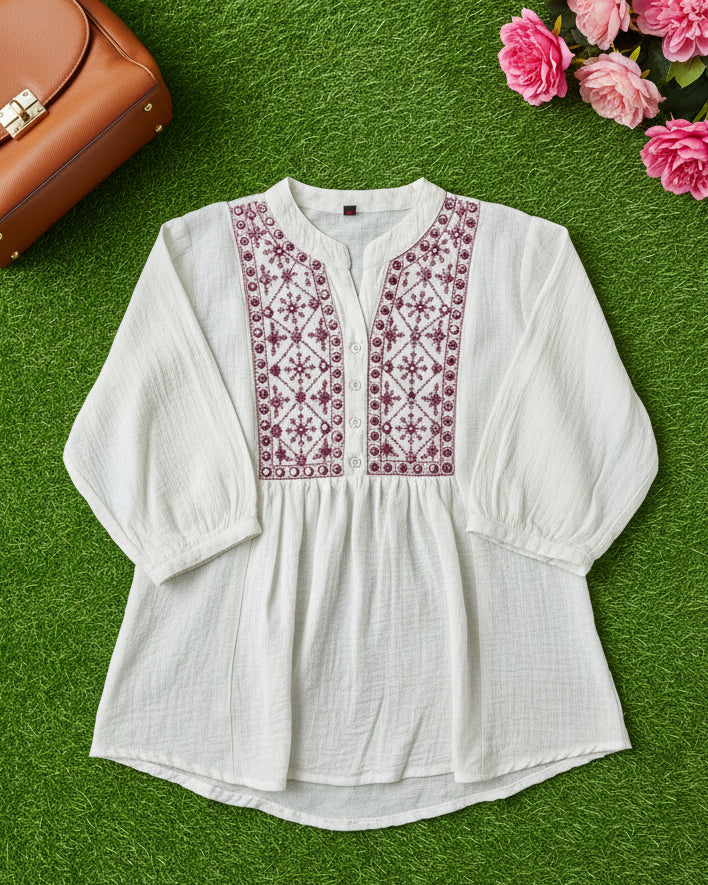 White blouse with pink embroidery 