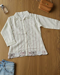 White embroidered women's shirt with pearl detailing on collar