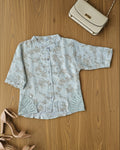 white floral-patterned shirt with buttons.